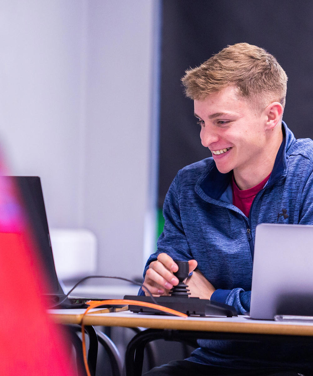 Sport Student Working On Laptop