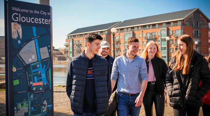Group of students walking around Gloucester Docks
