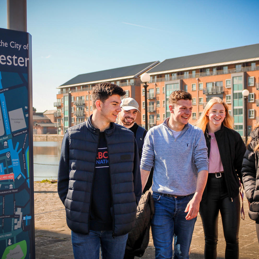 Group of students walking around Gloucester Docks