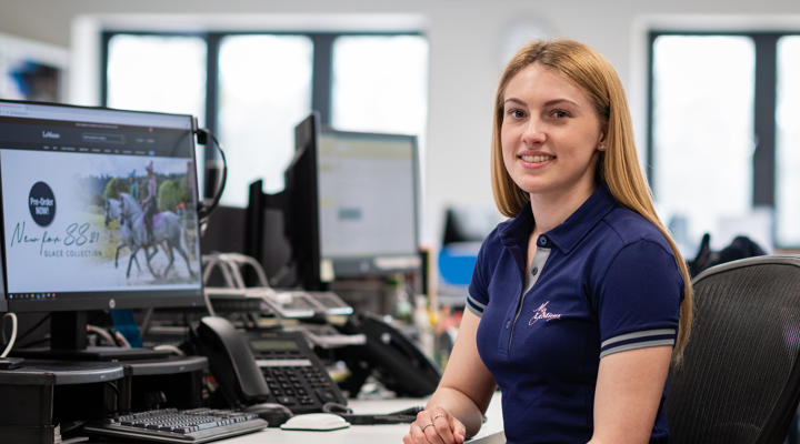 University Alumni Megan Batchelor working at a computer