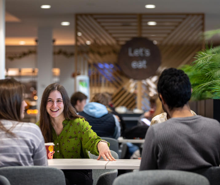 Group of students chatting in Graze restaurant