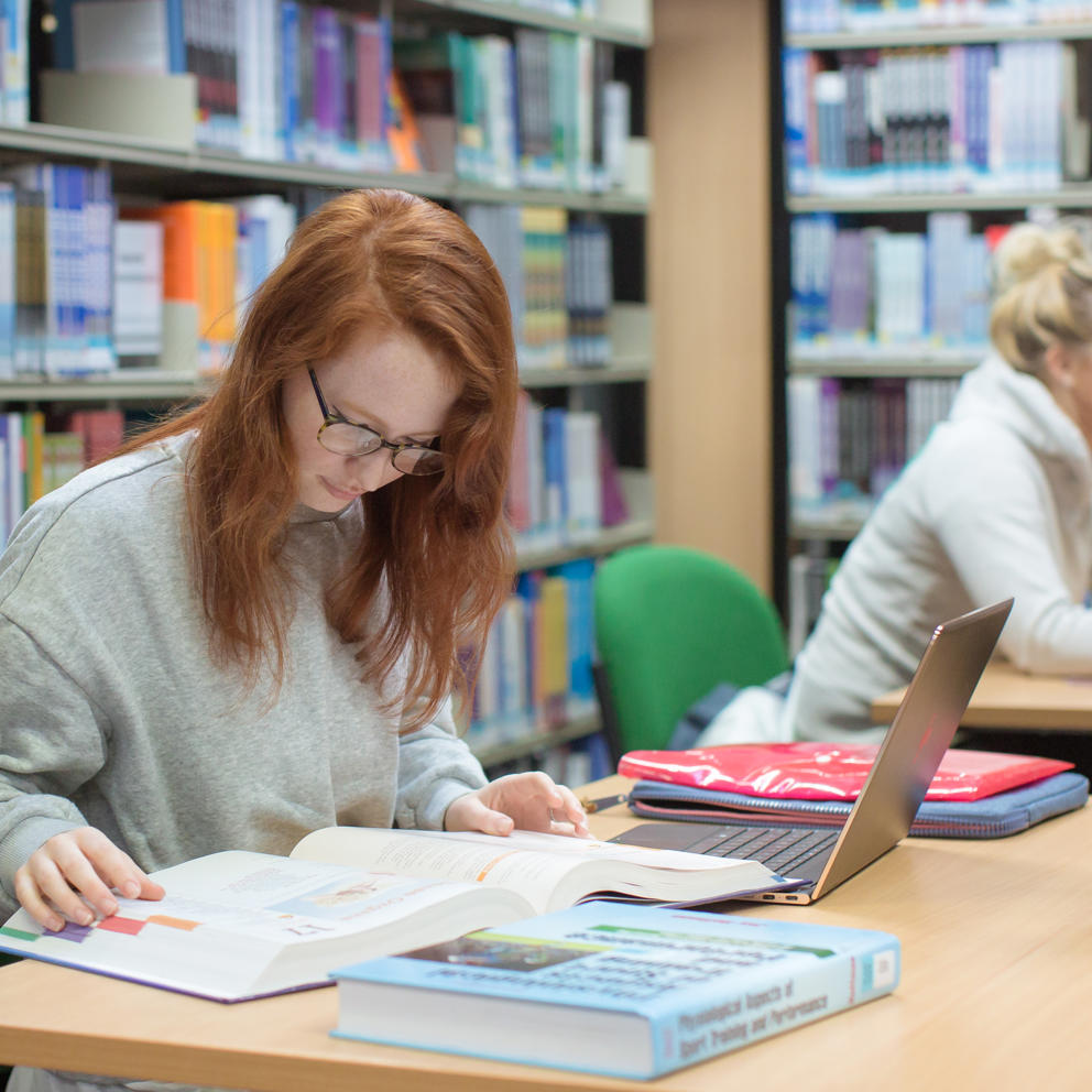 Students Studying In Library