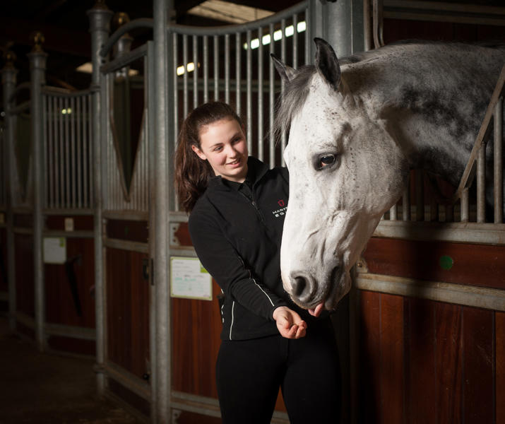 Student And Horse In Equine Yard