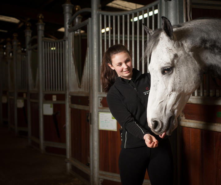 Student And Horse In Equine Yard