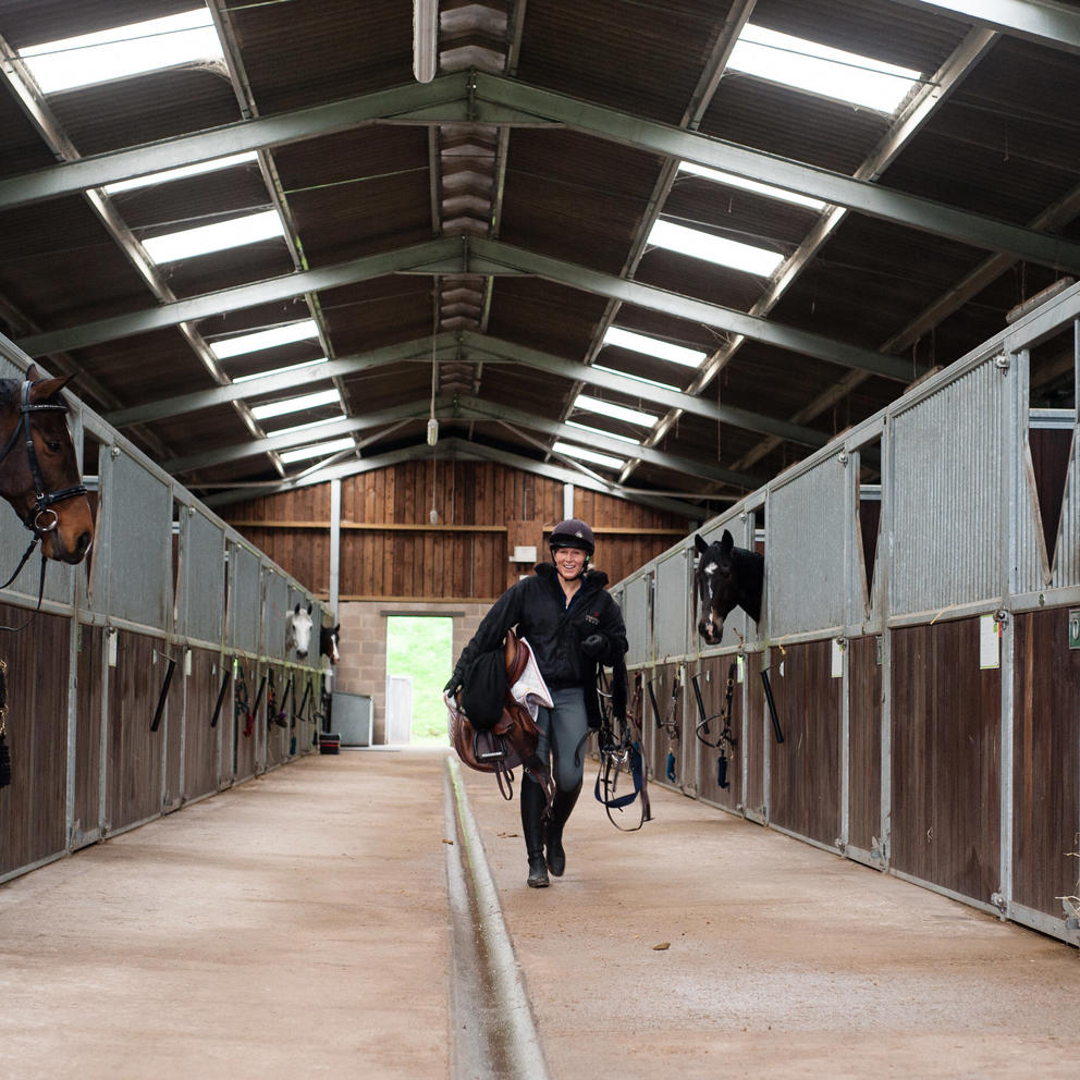 Student Walking Through Equine Yard