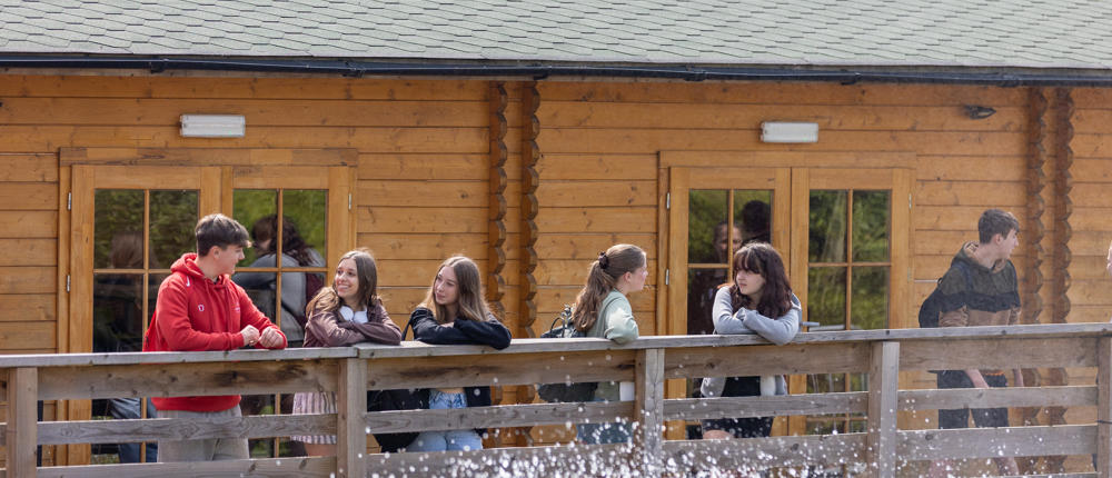 College Students Outside Cabin