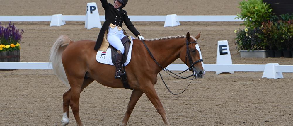 Rider From Iraq Punches The Air In Celebration