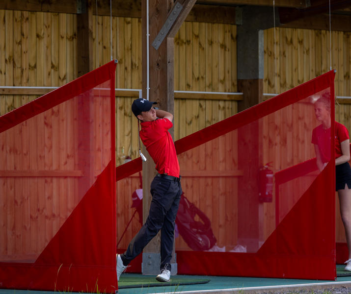 College Students On Driving Range