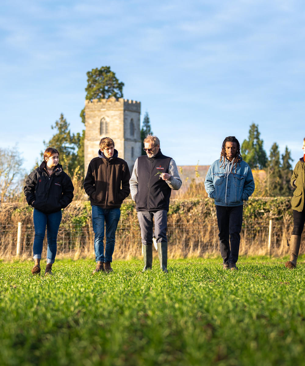 Students And Lecturer On Crop Walk