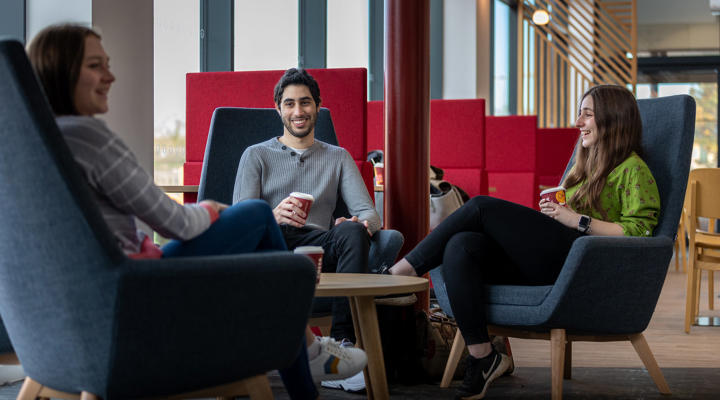 Three students drinking coffee in Graze