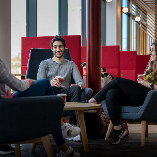 Three students drinking coffee in Graze