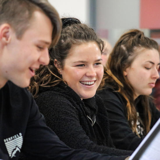 Image of students smiling in a lesson