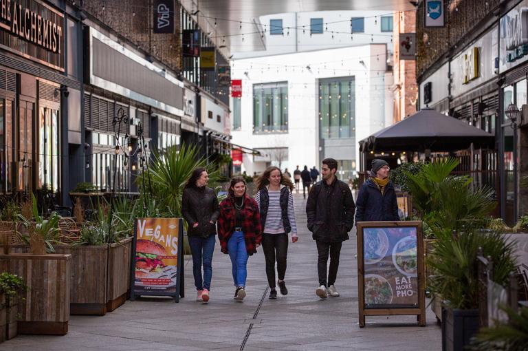 Students Walking Through The Brewery In Cheltenham