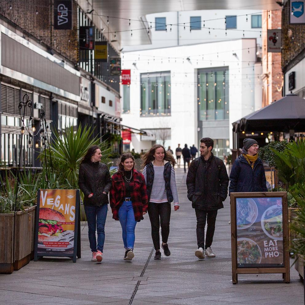 Students Walking Through The Brewery In Cheltenham