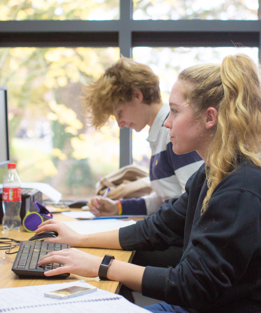 Two students working on computers