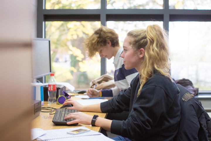 Two students working on computers