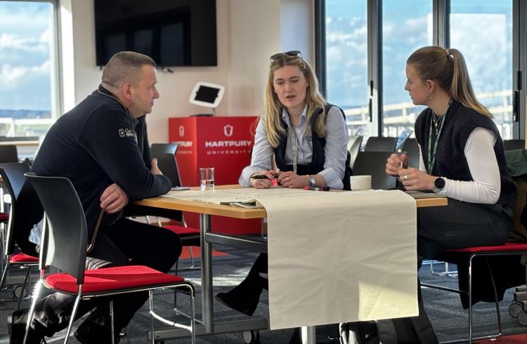 Three Pigtech Delegates At Table