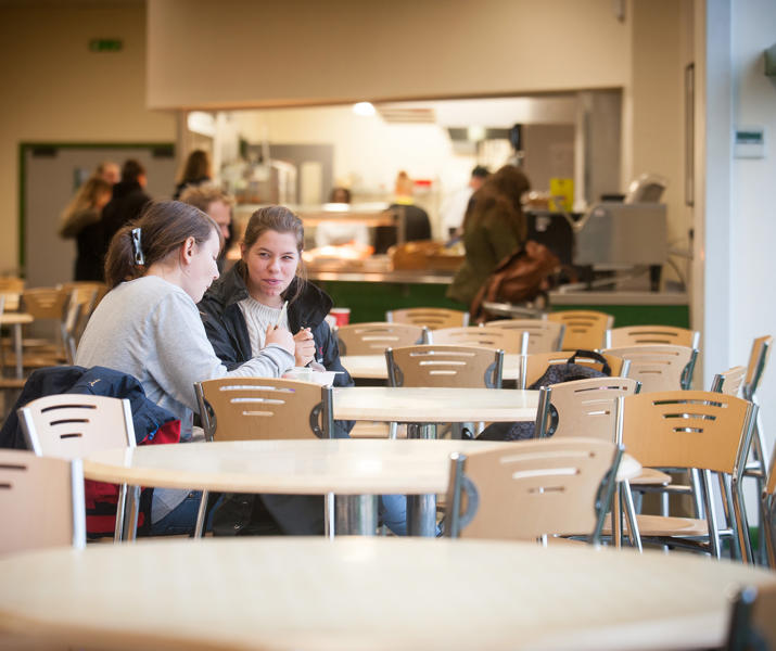 Two students eating in Equine Restaurant